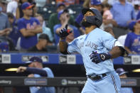 Toronto Blue Jays' Teoscar Hernandez gestures while running the bases after hitting a two-run home run during the third inning of the team's baseball game against the New York Mets, Saturday, July 24, 2021, in New York. (AP Photo/Mary Altaffer)