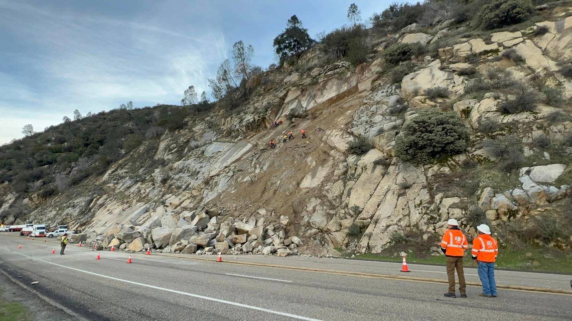 Caltrans workers check the rockslide that occurred Saturday, Dec. 31, 2022, on Highway 168 in eastern Fresno County.