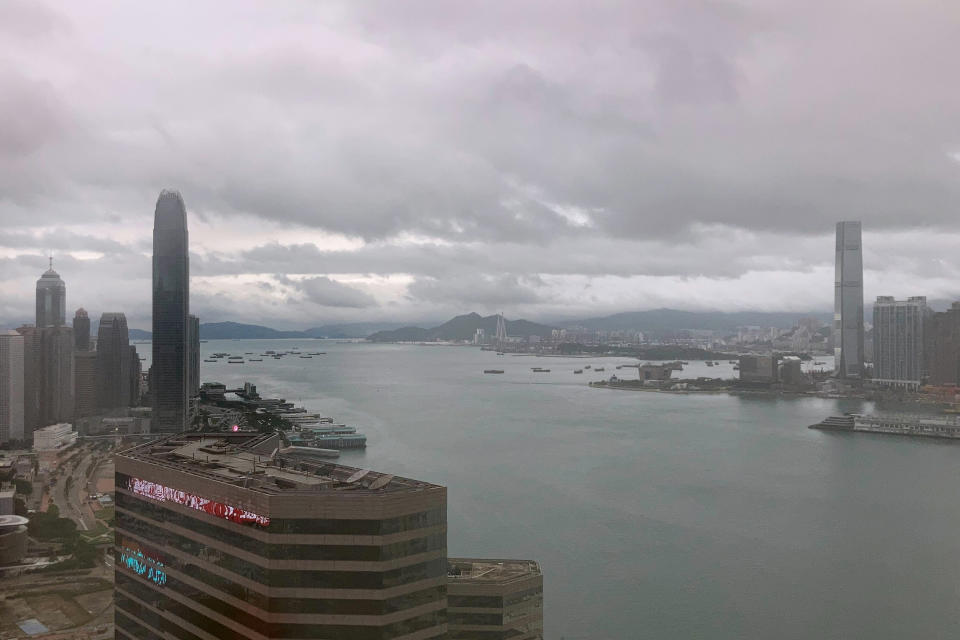 Storm clouds form over the harbor in Hong Kong, Wednesday, Nov. 2, 2022. Severe tropical storm Nalgae edged closer to Hong Kong on Wednesday and forced businesses to close, but the finance summit that's meant to restore the city's image as an international financial hub pressed ahead. (AP Photo/Kanis Leung)