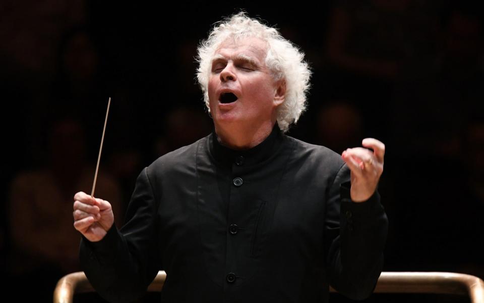 Sir Simon Rattle conducting the London Symphony Orchestra - Doug Peters