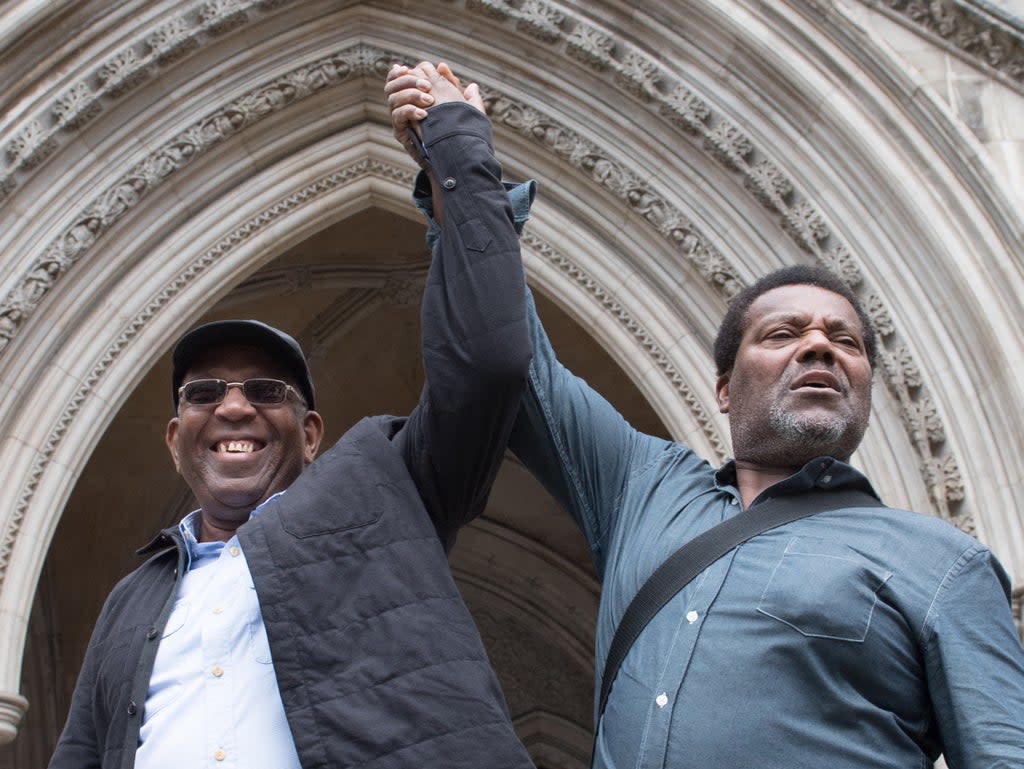 Two of the six, Paul Green (left) and Cleveland Davidson, after their convictions were quashed in July  (PA)