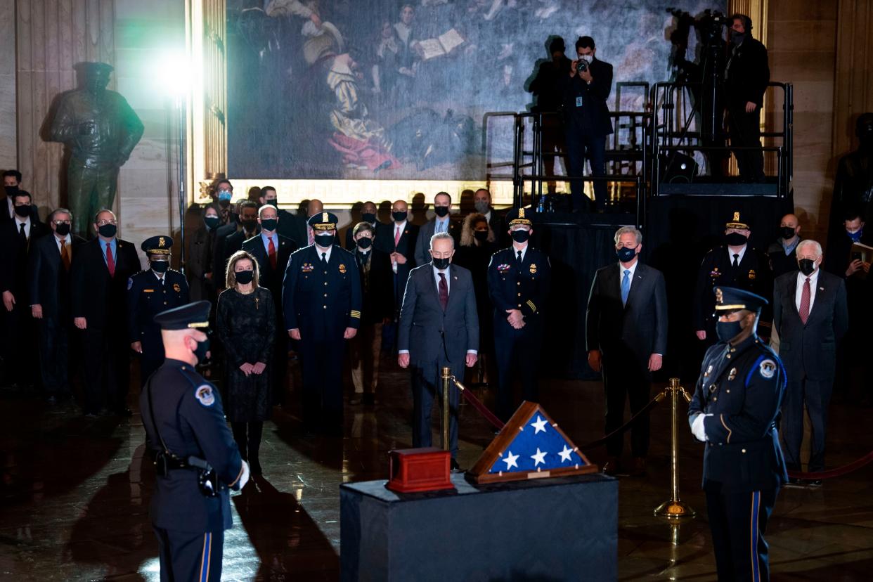 Capitol Police and lawmakers watch as the remains of Capitol Police officer Brian Sicknick, who died on January 7 from injuries he sustained while protecting the US Capitol during the January 6 attack on the building, arrive to lay in honor in the Rotunda of the US Capitol building in Washington, DC February 2, 2021.