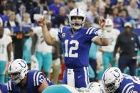 Nov 25, 2018; Indianapolis, IN, USA; Indianapolis Colts quarterback Andrew Luck (12) makes hand signals at the line of scrimmage against the Miami Dolphins during the third quarter at Lucas Oil Stadium. Mandatory Credit: Brian Spurlock-USA TODAY Sports