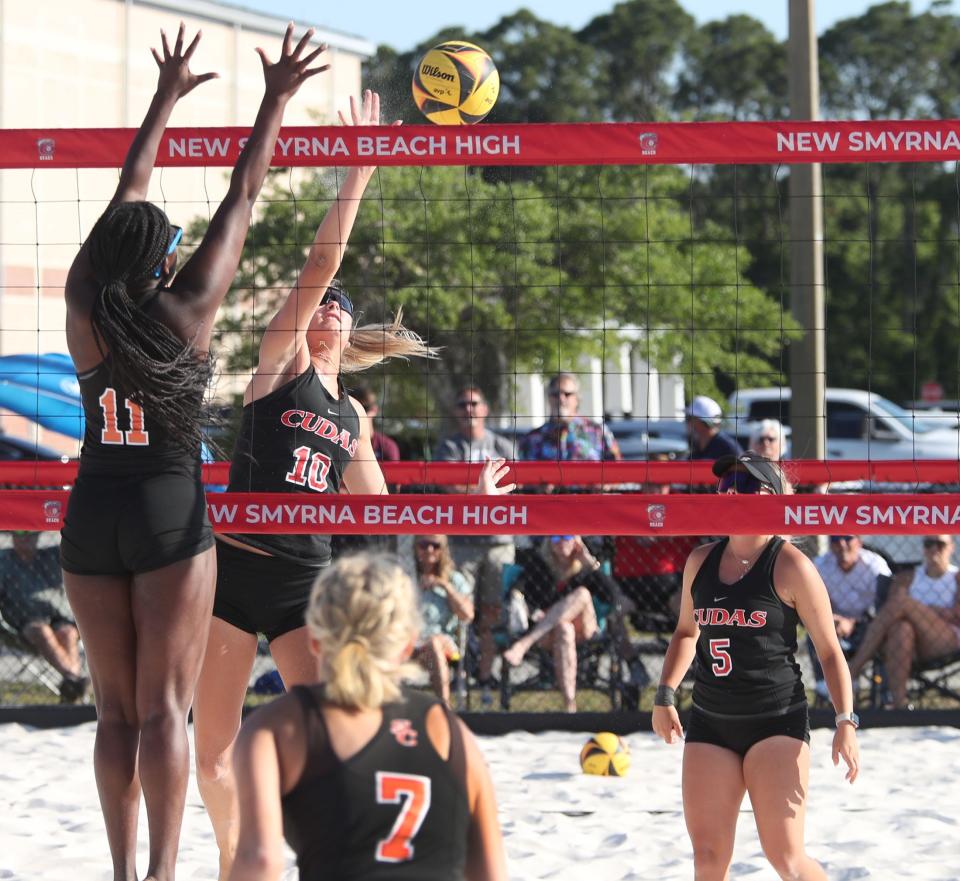 New Smyrna Beach's Kaelyn Fredette-Huffman (10) taps a point past Spruce Creek's Rebecca Boone (11) during the District 7-1A finals, Wednesday, April 24, 2024, at New Smyrna Beach High School.