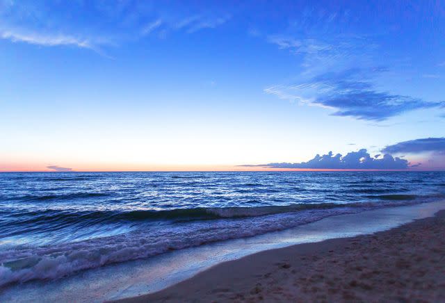 Pola Damonte/Moment/Getty Images Naples Beach is a tourist hot spot with beautiful views.