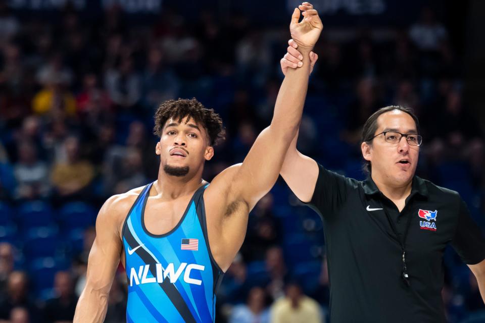 Carter Starocci has his hand raised after defeating Patrick Downey in a 86 kilogram challenge round preliminary bout during the U.S. Olympic Team Trials at the Bryce Jordan Center April 19, 2024, in State College. Starocci won by decision, 12-4.
