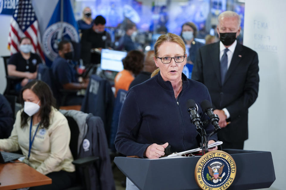 President Joe Biden listens as FEMA Administrator Deanne Criswell speaks at the National Response Coordination Center at FEMA headquarters, Sunday, Aug. 29, 2021, in Washington. (AP Photo/Manuel Balce Ceneta)