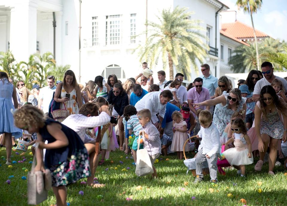 Children younger than 5 hunt for eggs during the Easter egg hunt at The Flagler Museum in April 2022.