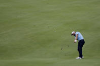 Dustin Johnson hits a shot from the 18th fairway during the final round of the Travelers Championship golf tournament at TPC River Highlands, Sunday, June 28, 2020, in Cromwell, Conn. (AP Photo/Frank Franklin II)