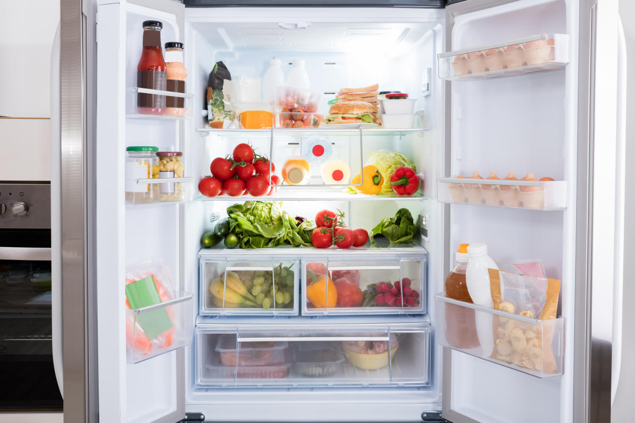 Open Refrigerator Filled With Fresh Fruits And Vegetable