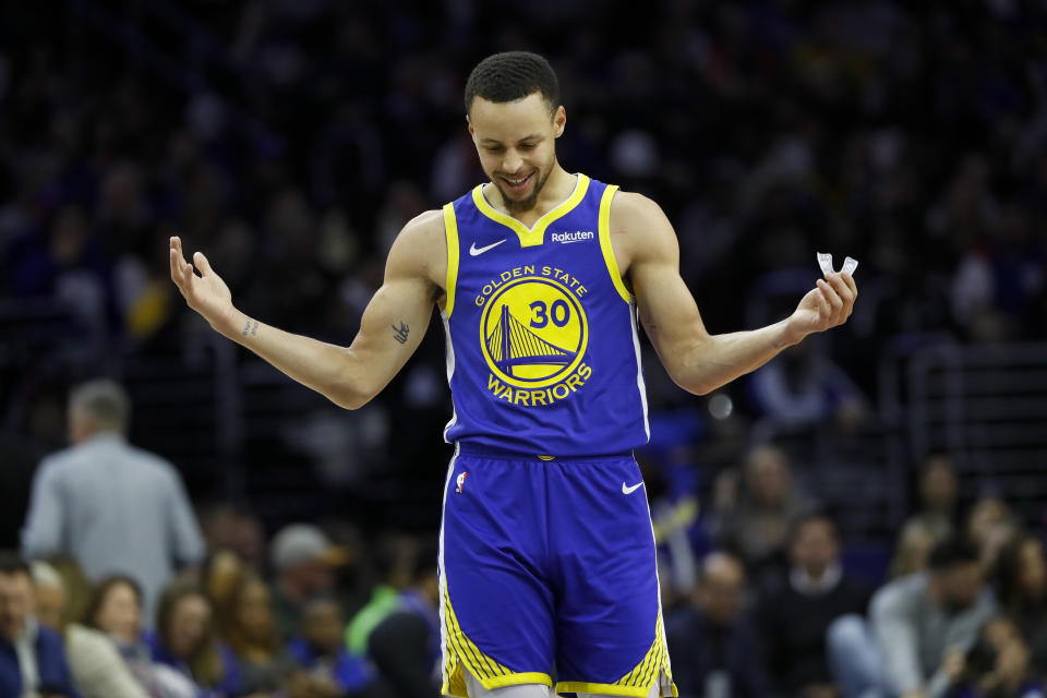 Golden State Warriors' Stephen Curry reacts after a foul was called against him during the first half of an NBA basketball game against the Philadelphia 76ers, Saturday, March 2, 2019, in Philadelphia. (AP Photo/Matt Slocum)