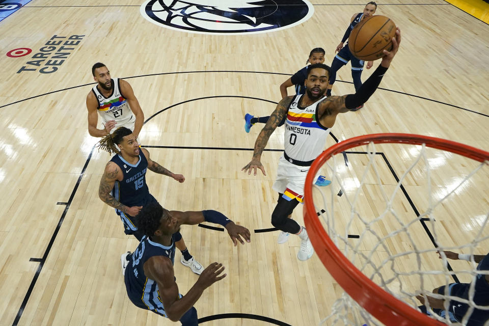 Minnesota Timberwolves guard D'Angelo Russell (0) goes up for a shot during the first half of an NBA basketball game against the Memphis Grizzlies, Friday, Jan. 27, 2023, in Minneapolis. (AP Photo/Abbie Parr)