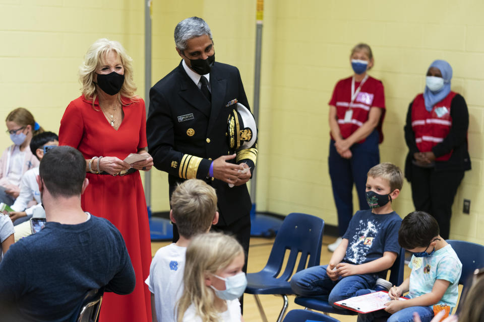 First lady Jill Biden with Surgeon General Dr. Vivek Murthy, talk to students during a visit to a pediatric COVID-19 vaccination clinic at Franklin Sherman Elementary School in McLean, Va., to kick off a nationwide effort urging parents and guardians to vaccinate kids ages 5 to 11, Monday, Nov. 8, 2021. (AP Photo/Manuel Balce Ceneta)