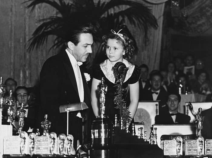 Shirley Temple presenting the award to Walt Disney