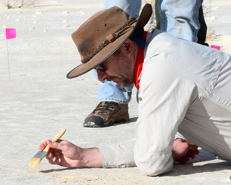 <span class="caption">Matthew Bennett, dusting for prints.</span> <span class="attribution"><span class="source">David Bustos, National Park Service</span></span>