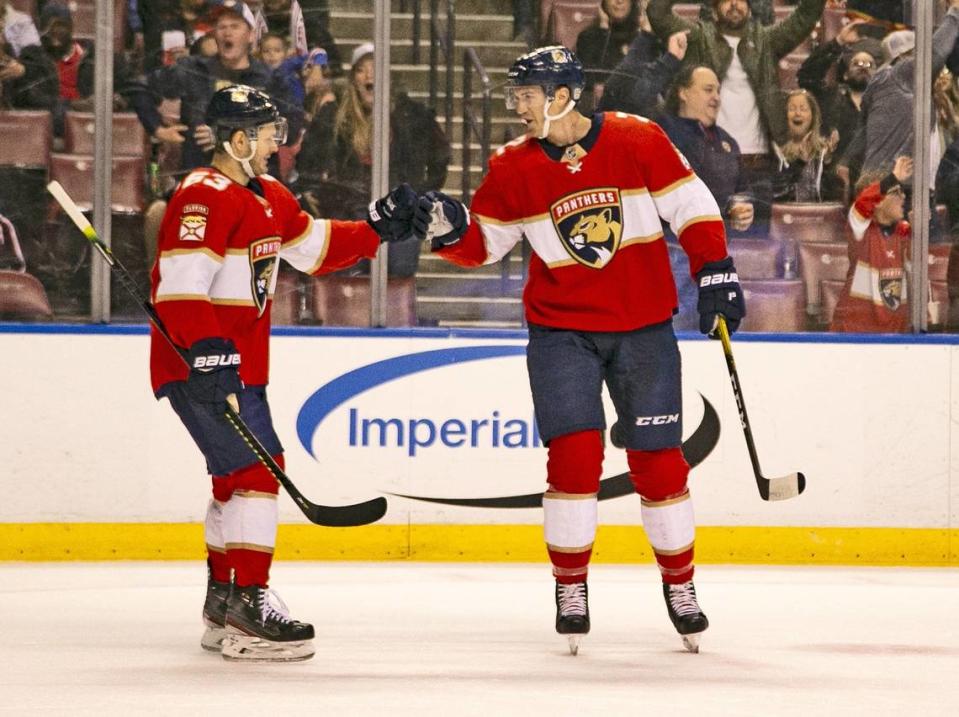 Florida Panthers defenseman Josh Brown (2) and right wing Evgenii Dadonov (63) celebrate after Brown scores in the second period as the Florida Panthers host the Columbus Blue Jackets at the BB&T Center in Sunrise on Saturday, December 7, 2019.