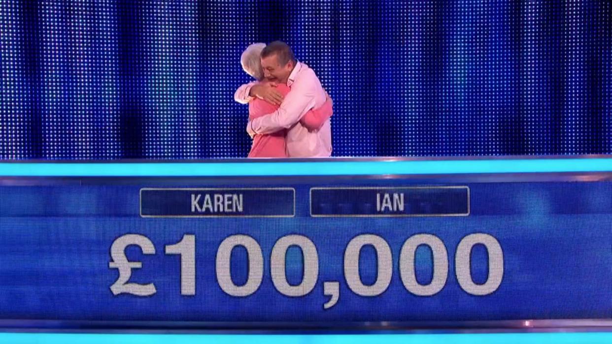 karen, ian hug after winning on the chase