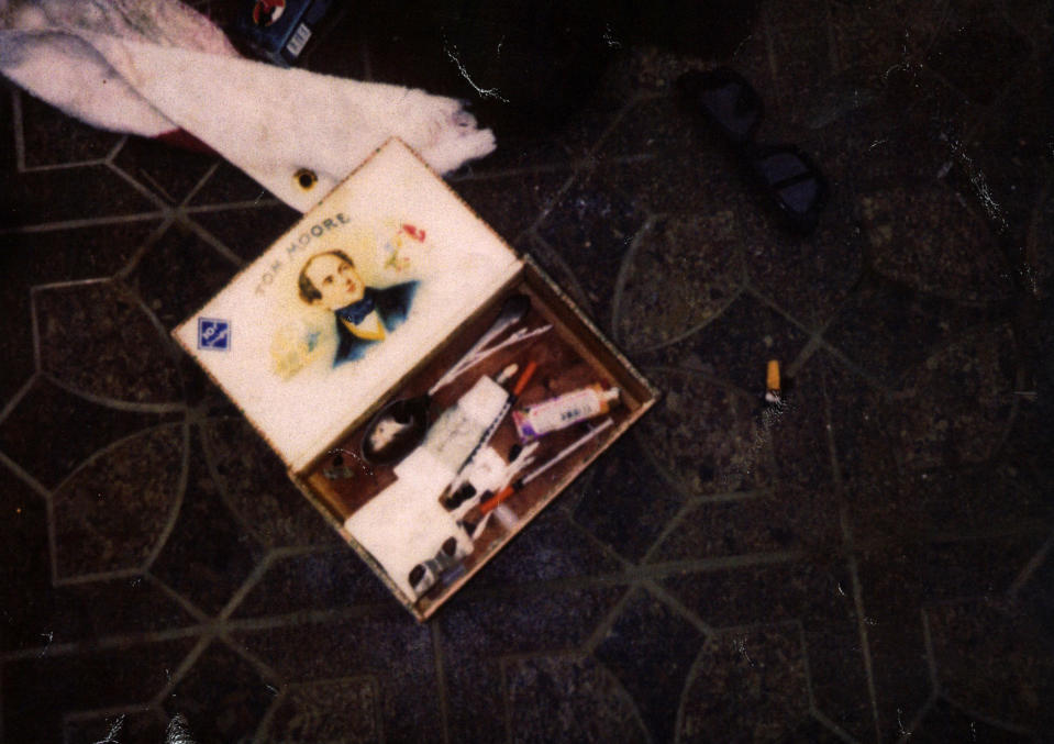 This April 1994 photo provided by the Seattle Police Department shows items found at the scene of Kurt Cobain's suicide, in Seattle. The image has never before been released. Police spokeswoman Renee Witt said Thursday, March 20, 2014, that several rolls of undeveloped film were found when a detective re-examined the Cobain case recently. (AP Photo/Seattle Police Department)