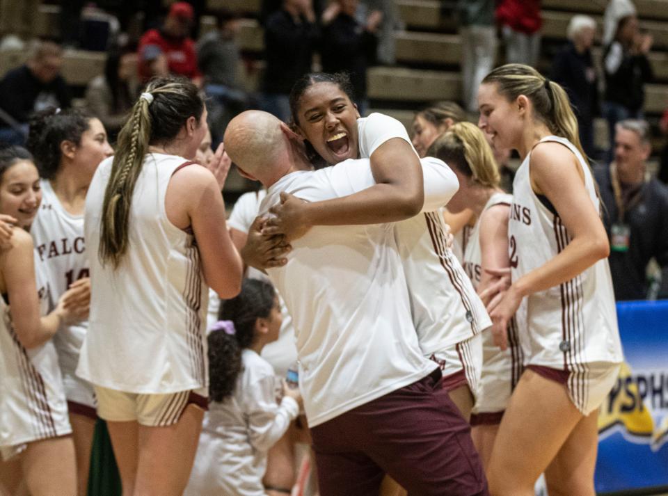 Albertus Magnus celebrates after defeating Hilton 67-50 in the New York State girls Class AA basketball championship at Hudson Valley Community College in Troy March 16, 2024.