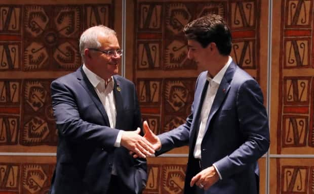 Australia's Prime Minister Scott Morrison shakes hands with Prime Minister Justin Trudeau during a bilateral meeting on the sidelines of the APEC Summit in Port Moresby, Papua New Guinea November 18, 2018.