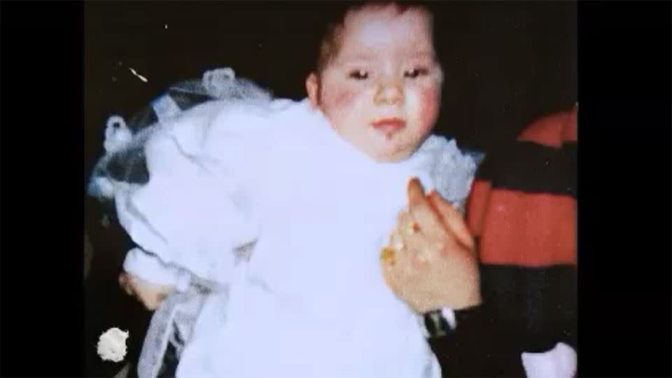 Lorena Cobuzzi at her christening when her parents believed she was their daughter. Photo: Youtube/Nefark Ederki