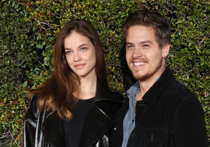 A close-up of the couple smiling at an event