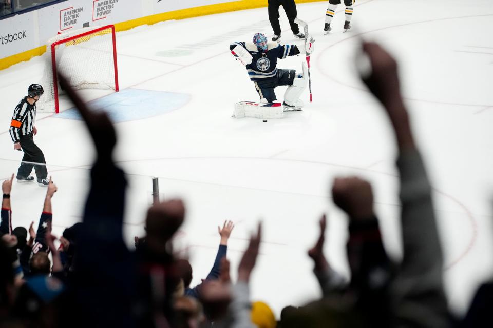 Mar 30, 2024; Columbus, Ohio, USA; Columbus Blue Jackets goaltender Elvis Merzlikins (90) celebrates the 4-3 shootout win over the Pittsburgh Penguins in the NHL hockey game at Nationwide Arena.