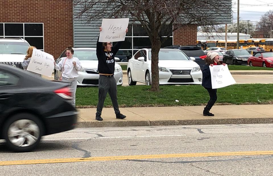 Students stand outside the Evansville Vanderburgh School Corp. administration building on Monday, March 14, 2023, to protest the announced closure of Harwood Career Preparatory High School.