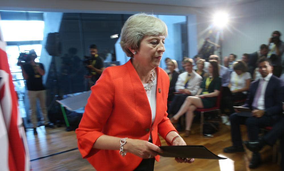 Theresa May departs after speaking to the media at the conclusion of the summit in Salzburg.