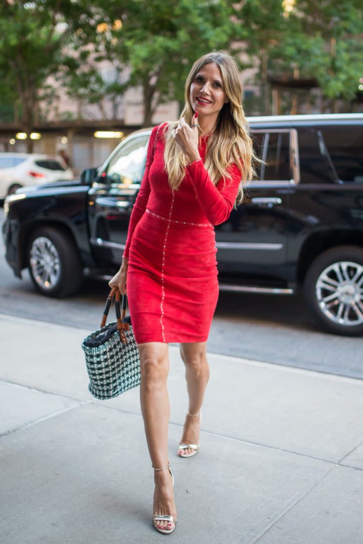 Klum also donned a red minidress. (Photo: Getty Images)