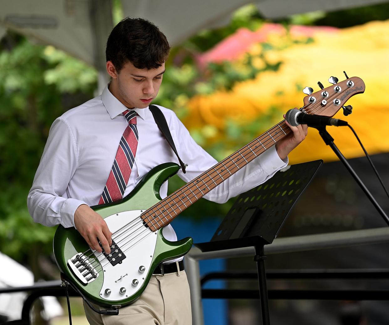 Ian Richardson, 18, of Franklin plays base for the Padula Trio Plus One during the second annual Franklin Blues Festival, part of Franklin's annual 5-day Fourth of July festivities, on Franklin Town Common July 2, 2022.