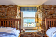 <p>Watch the waves crash against the shore from Cove Cottage, a cosy bolthole in the far west of Cornwall. Sleeping six, the former fisherman’s cottage has been lovingly restored to offer modern comforts while retaining its period character with slate floors, deep window seats, exposed stonework and a large fireplace. Seven nights’ self-catering from £705 (arriving December 21 or 28). <em>[Photo: Beach Retreats]</em> </p>