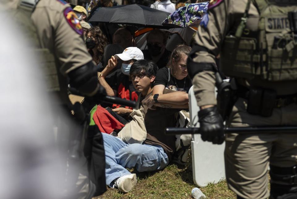 Texas Department of Public Safety troopers surround a pro-Palestinian encampment on the University of Texas at Austin campus on Monday, April 29, 2024.