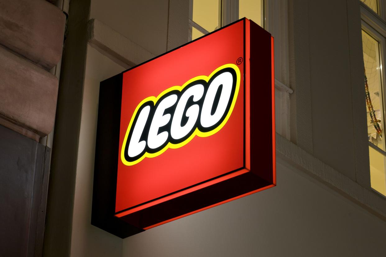 Wiesbaden, Germany - March 10, 2011: Illuminated sign of Lego Store in the center of Wiesbaden, Germany. Lego Group is a construction toys manufacturer based in Billund, Denmark. LEGO toys are made out of colorful hard plastic construction blocks.