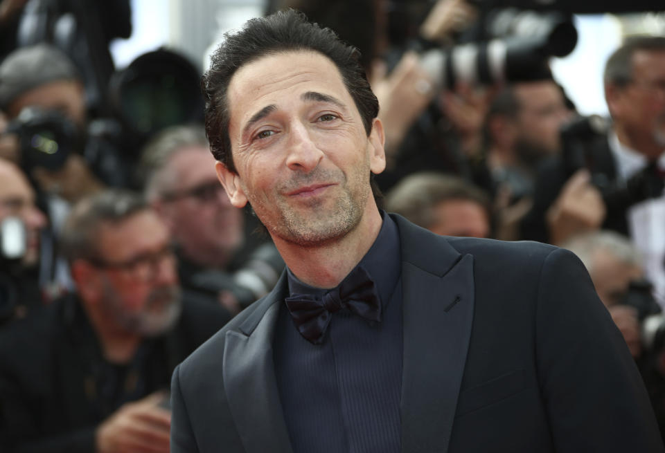 Actor Adrien Brody poses for photographers as he arrives at the premiere of the film 