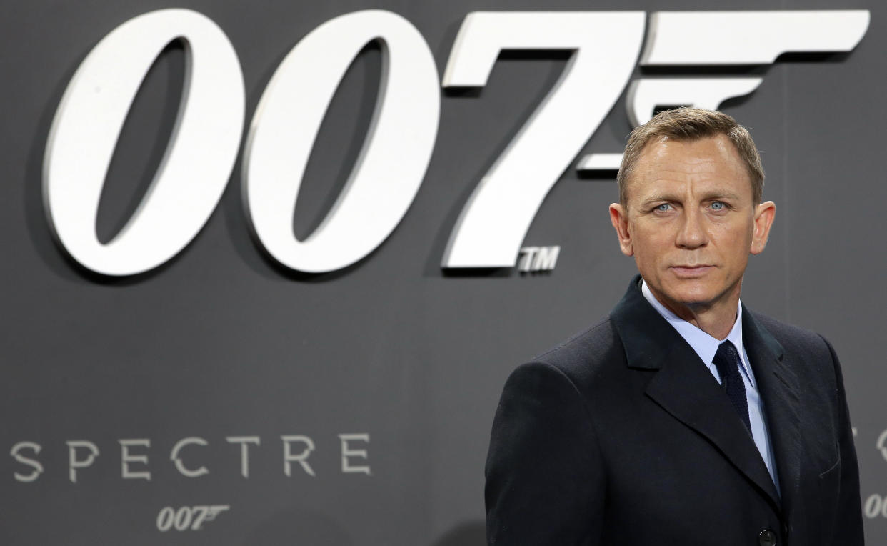 FILE - In this Oct. 28, 2015, file photo, actor Daniel Craig poses for the media as he arrives for the German premiere of the James Bond movie 'Spectre' in Berlin, Germany. Craig announced on "The Late Show with Stephen Colbert” Aug. 15, 2017, that he would return as the British super spy in 2019's "Bond 25." (AP Photo/Michael Sohn, File)