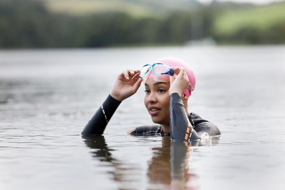 woman in Cornwall,UK swimming in lake