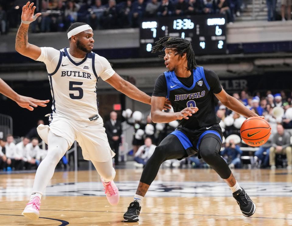 Buffalo Bulls guard Kanye Jones (0) rushes up the court against Butler Bulldogs guard Posh Alexander (5) on Tuesday, Dec. 5, 2023, during the game at Hinkle Fieldhouse in Indianapolis. The Butler Bulldogs defeated the Buffalo Bulls, 72-59.