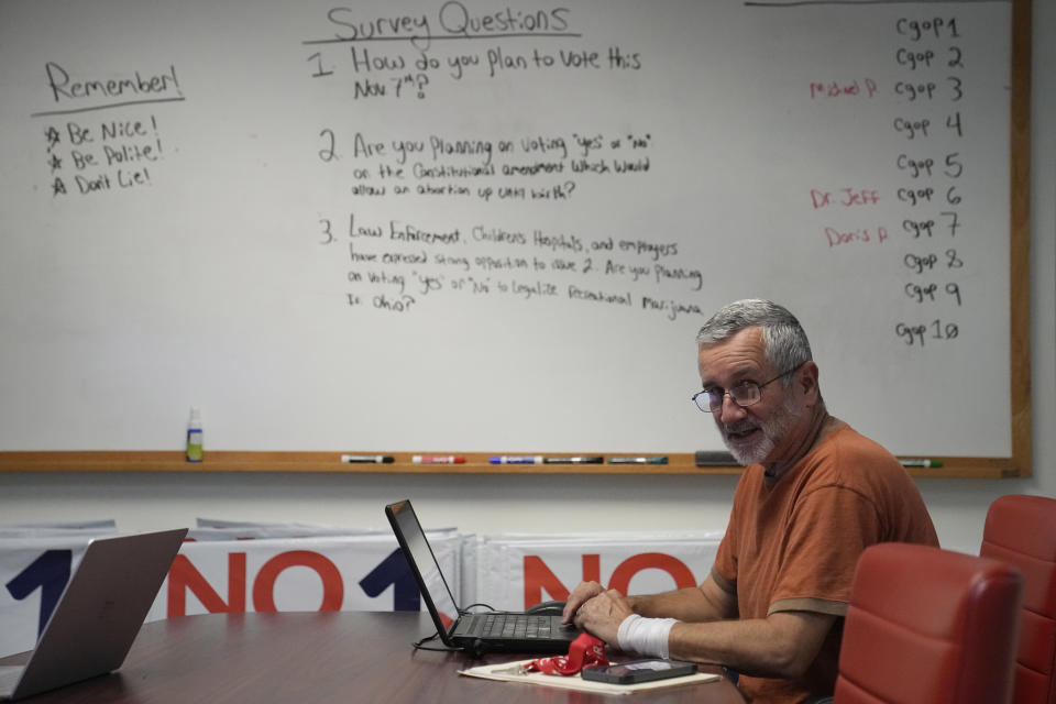 Jeff Koloze calls voters during a phone bank event on Thursday, Sept. 28, 2023, at the Republican Party of Cuyahoga County in Independence, Ohio. (AP Photo/Sue Ogrocki)