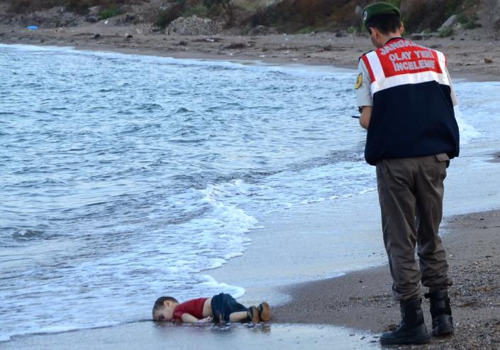 Aylan Kurdi's body lies on the beach at Bodrum, Turkey, on September 2, 2015 after a boat sank while trying to reach Kos (AFP Photo/Nilufer Demir)