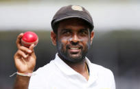 Cricket - Sri Lanka v South Africa - First Test Match - Galle, Sri Lanka - July 14, 2018 - Sri Lanka's Dilruwan Perera shows the ball as he celebrates taking six wickets. REUTERS/Dinuka Liyanawatte