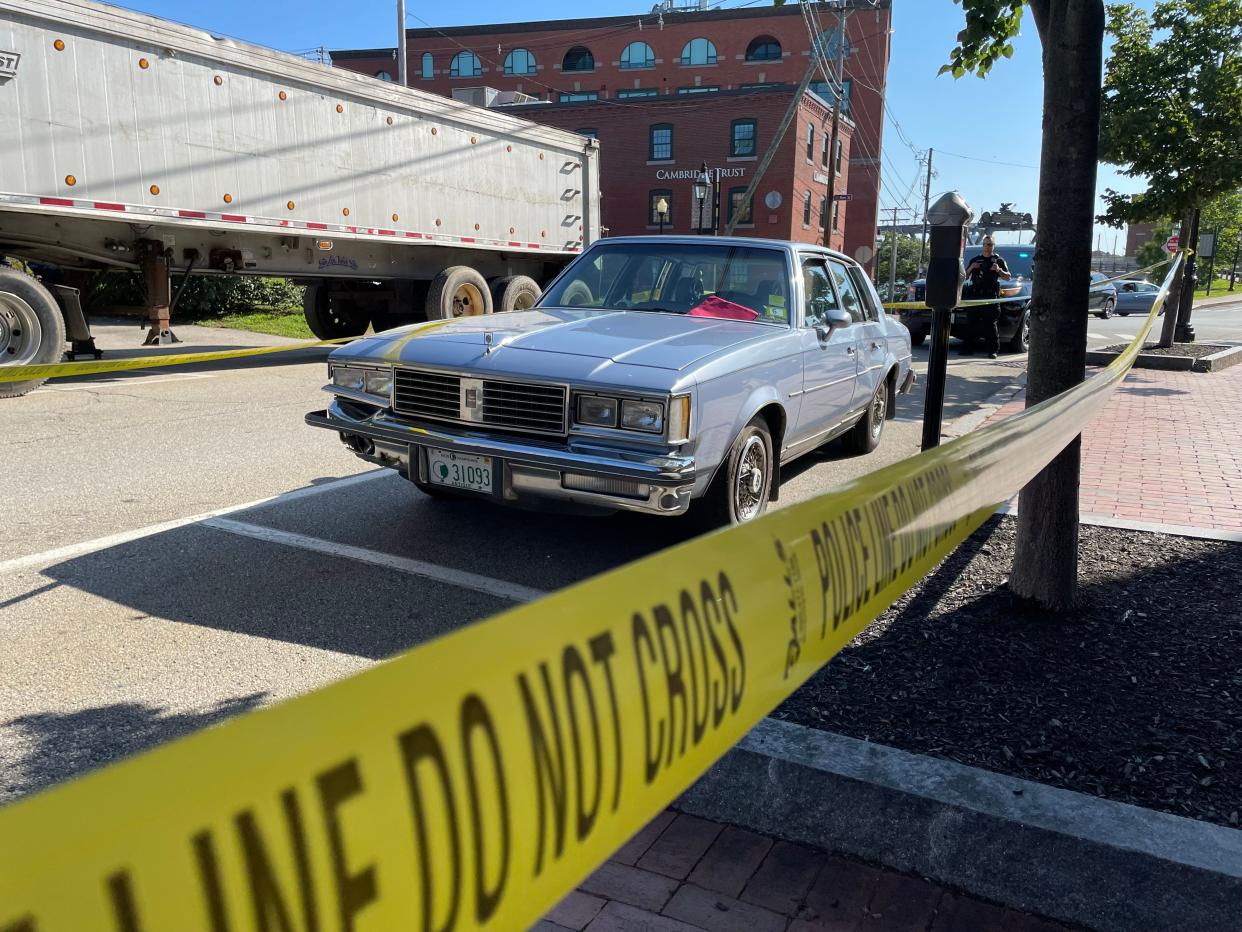 An Oldsmobile Cutlass Supreme is surrounded by crime tape on Daniel Street in Portsmouth Tuesday, Aug. 1, 2023, after it struck a pedestrian near Prescott Park early in the morning, according to police.