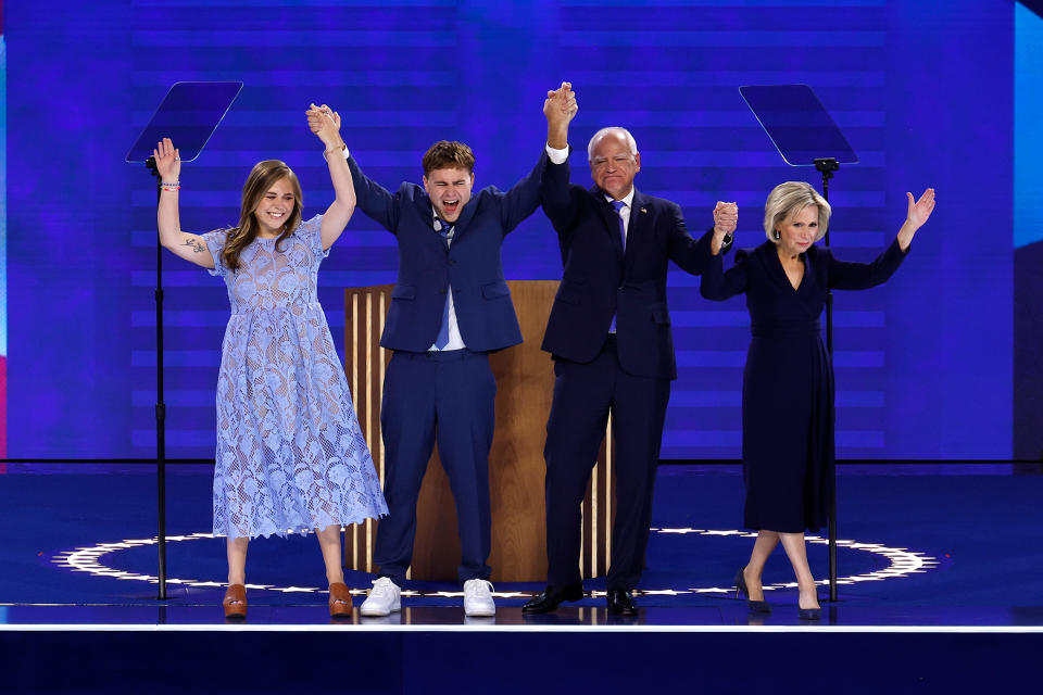 CHICAGO, ILLINOIS - AUGUST 21: Democratic vice presidential candidate Minnesota Governor Tim Walz celebrates with his daughter Hope Walz (L), son Gus Walz (2nd L) and wife Gwen Walz (R) accepting the Democratic vice presidential nominee onstage during the third day of the Democratic National Convention at the United Center on August 21, 2024 in Chicago, Illinois. Democratic Party delegates, politicians and supporters are in Chicago for the convention, which culminates with current Vice President Kamala Harris accepting her party's presidential nominee. The DNC takes place August 19-22. (Photo by Chip Somodevilla/Getty Images)