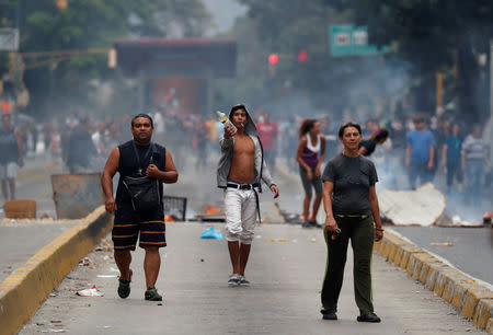 Demonstrators gather at a protest against the government of Venezuelan President Nicolas Maduro in Caracas, Venezuela March 31, 2019. REUTERS/Carlos Garcia Rawlins