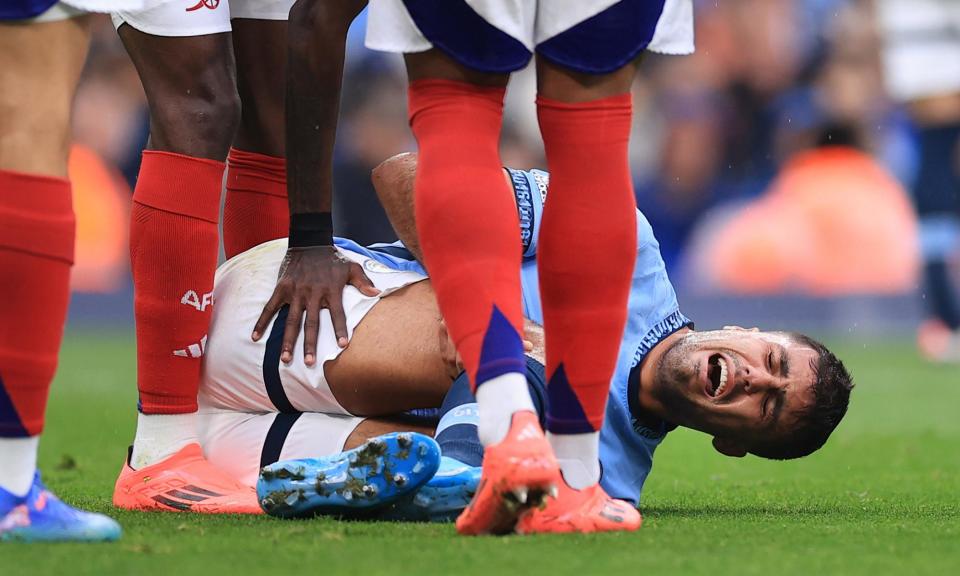 <span>Rodri suffered an anterior cruciate ligament injury in Manchester City’s 2-2 draw with Arsenal at the Etihad Stadium on Sunday.</span><span>Photograph: Simon Stacpoole/Offside/Getty Images</span>