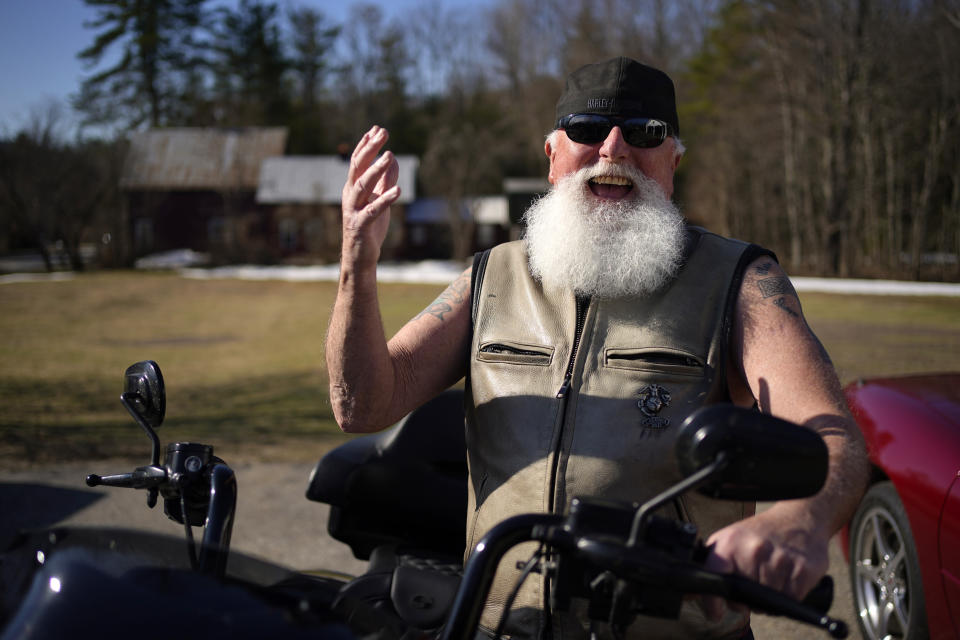 Steve Downing speaks with a reporter in Conway, N.H., Thursday, April 13, 2023. The Vietnam veteran supports a local bakery in its fight with the town to keep a student-painted mural on top of its building. (AP Photo/Robert F. Bukaty)