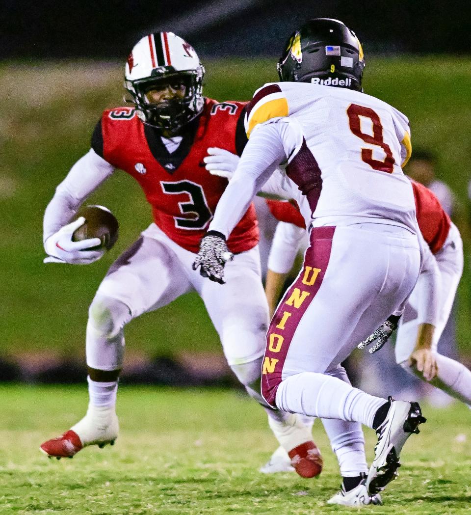 Hanford's Kourdey Glass avoids Tulare Union's Fransisco Fernandez in a West Yosemite League high school football game on Thursday, October 6, 2022. 