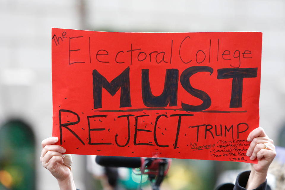 Anti-Trump protesters gather as Electoral College votes