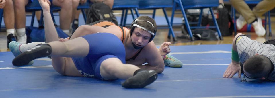 Logan Sallows of Hudson pins Aiden Massingill of Dundee in the 215 pound match in their league dual meet Wednesday, February 1, 2023.