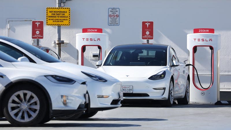 Tesla cars recharge at a Tesla Supercharger station on February 15, 2023 in San Francisco, California.